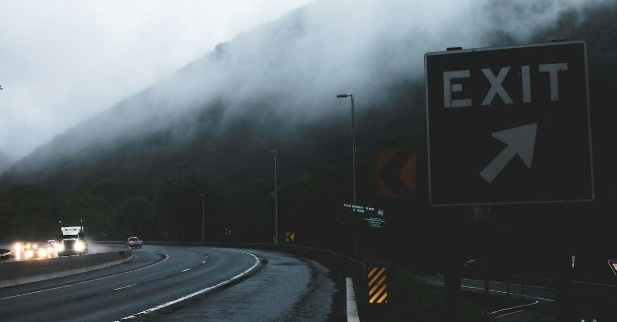 black-and-white-exit-signage-on-roadside