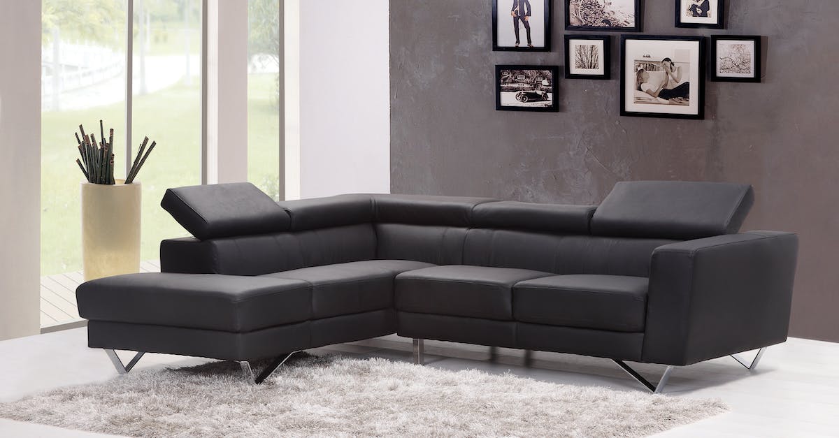 black-fabric-sectional-sofa-near-glass-window