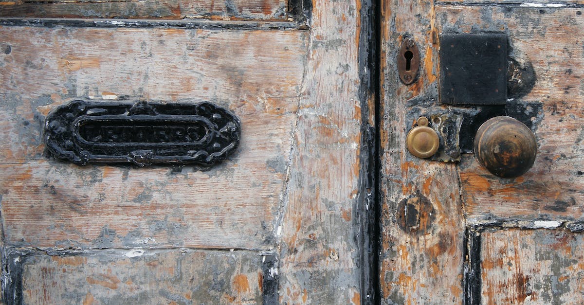 black-mail-sliding-on-ugly-wooden-door