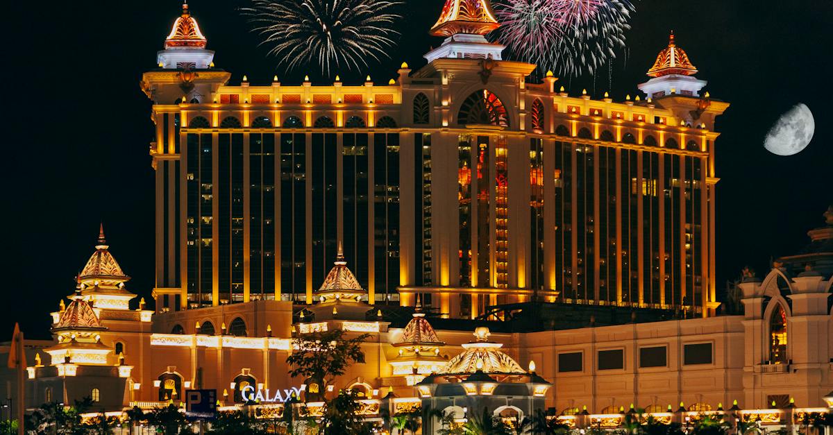 colorful-firework-over-famous-modern-palace-with-illuminated-facade-and-square-located-in-macau-at-n-1