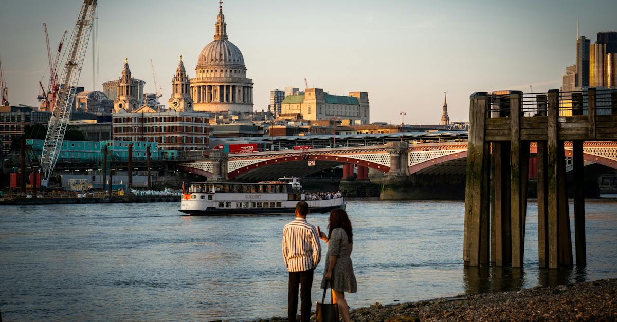 couple-standing-near-thames-with-saint-pauls-cathedral-behind