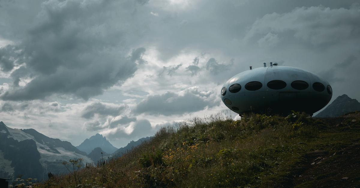 fabricated-spaceship-on-grass-field-under-gray-clouds