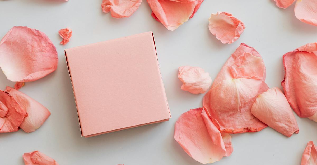gift-in-pink-box-with-scattered-petals-around