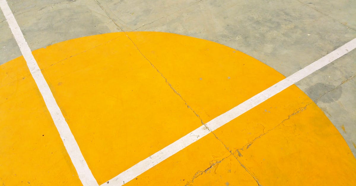 gray-concrete-pavement-with-yellow-and-white-paint