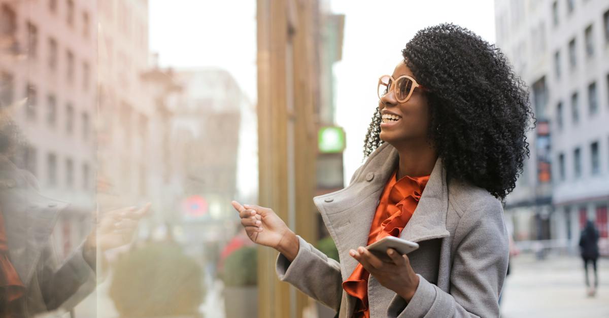 happy-black-woman-laughing-on-street-1