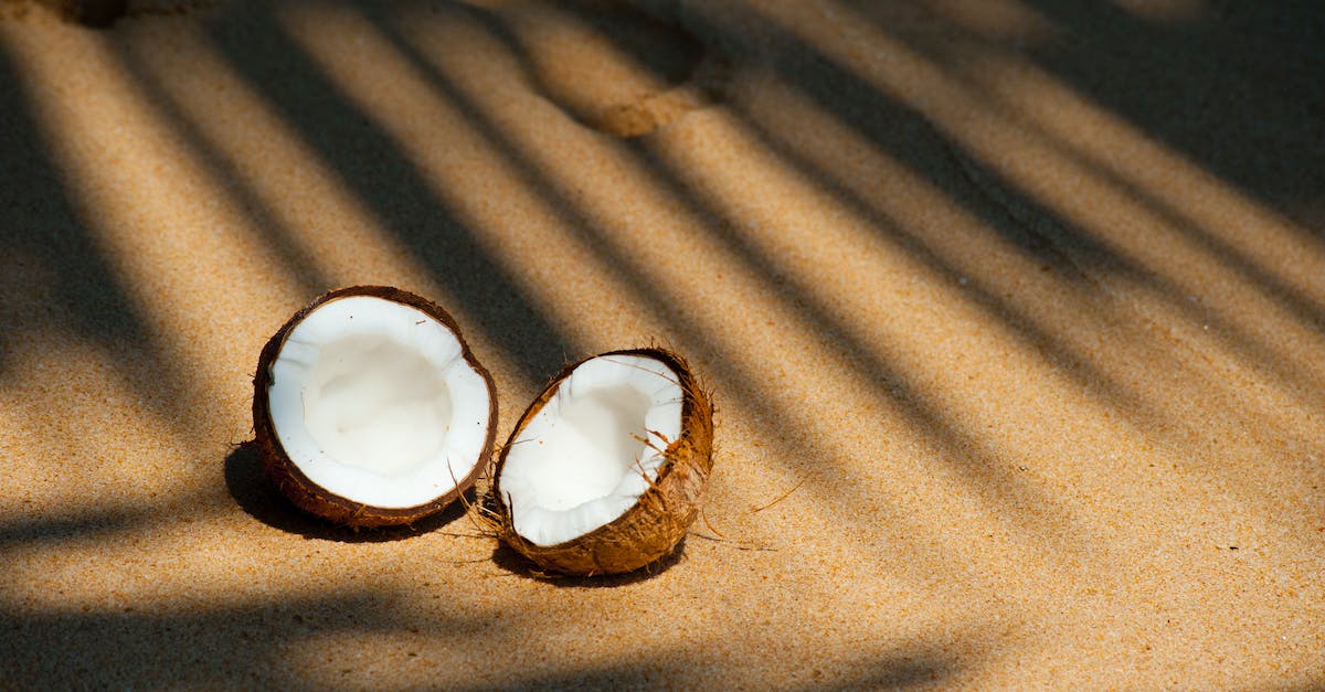 opened-coconut-on-sands