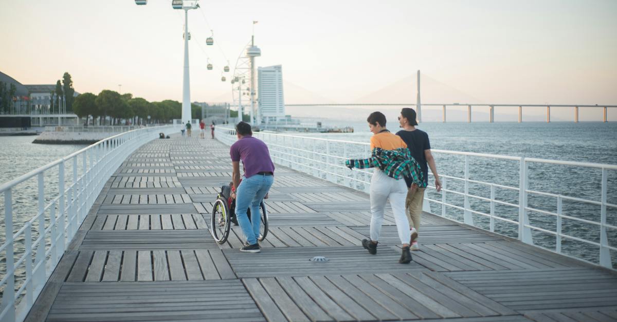 people-walking-on-the-bridge-near-the-sea