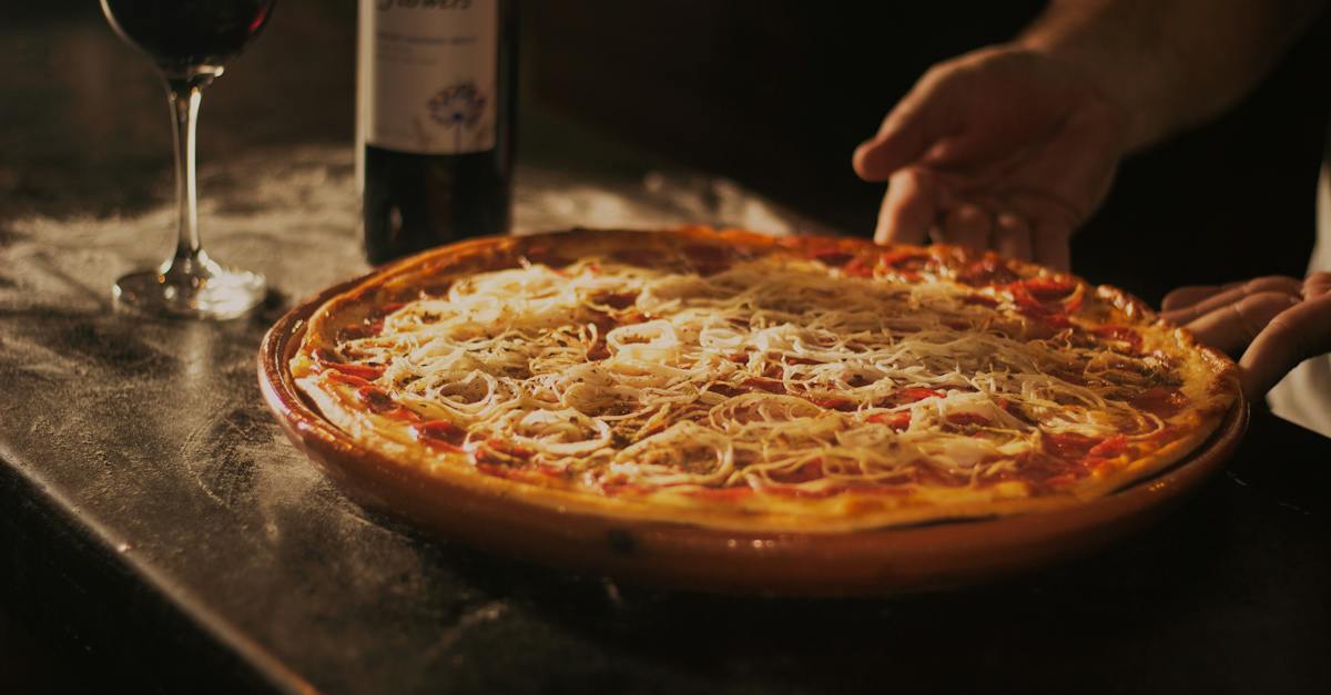 person-holding-pepperoni-pizza-on-tray