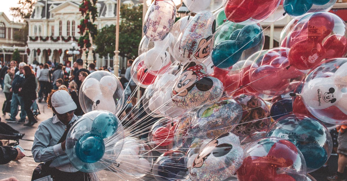 photo-of-person-holding-balloons