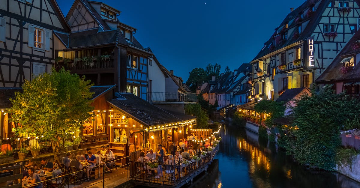 photography-of-buildings-and-canal-during-nighttime