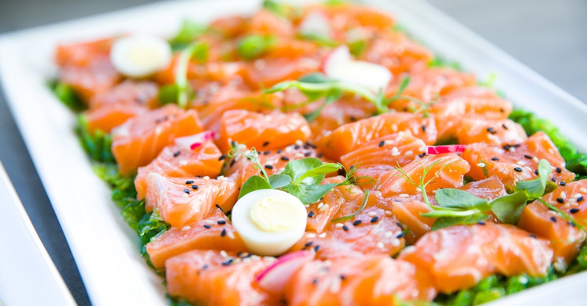 salmon-with-greens-and-quail-eggs-on-banquet-table-1