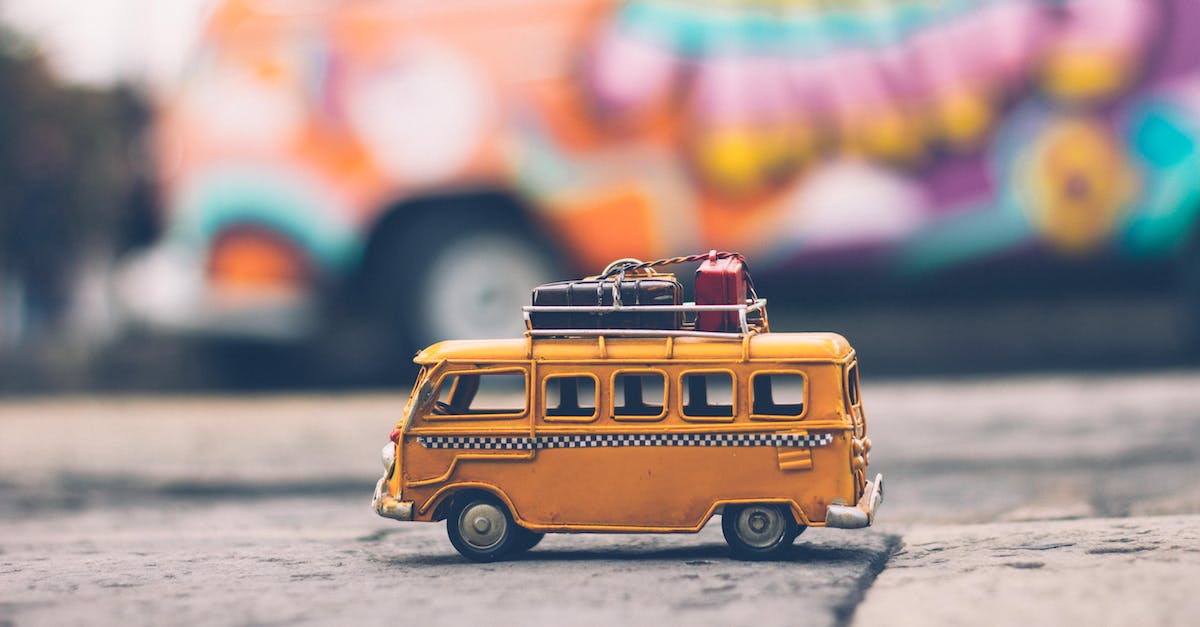 selective-focus-photography-of-yellow-school-bus-die-cast