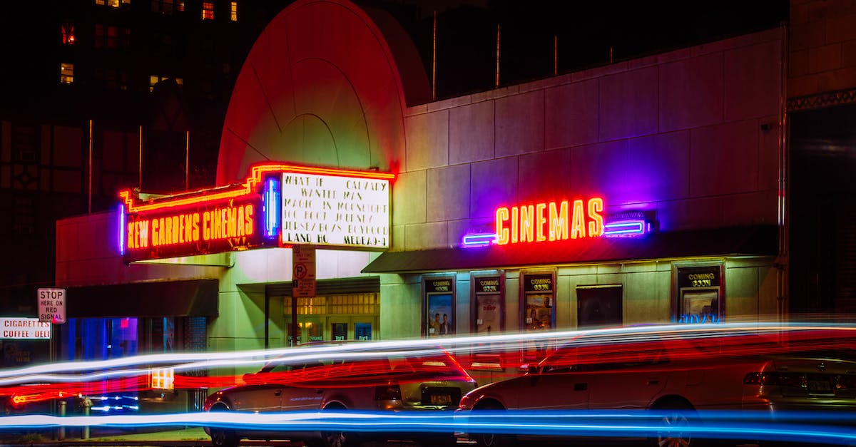 time-lapse-photography-of-car-lights-in-front-of-cinema