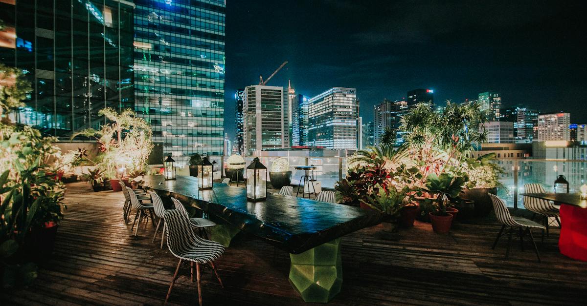 view-of-the-cityscape-from-a-rooftop-garden-restaurant-at-night-1