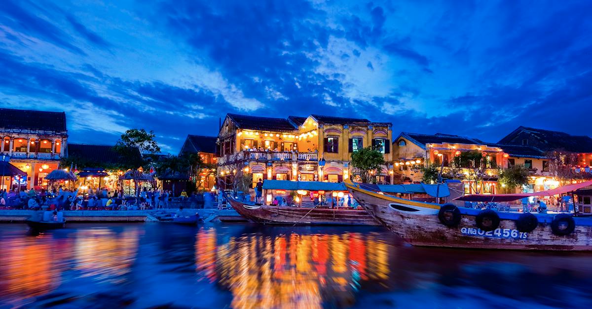 village-near-body-of-water-photo-during-nighttime