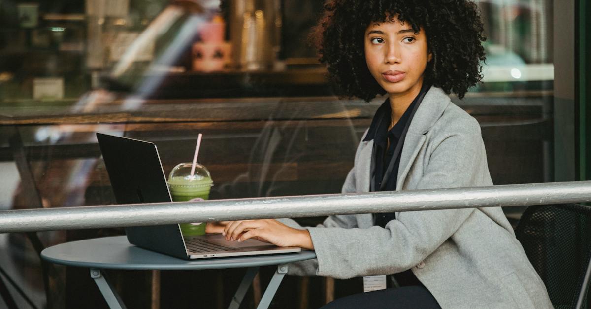 woman-in-gray-blazer-sitting-near-glass-window-10