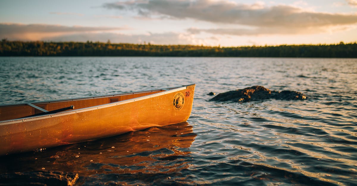 yellow-canoe-on-body-of-water